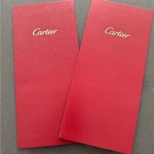 Two Cartier receipt sleeves